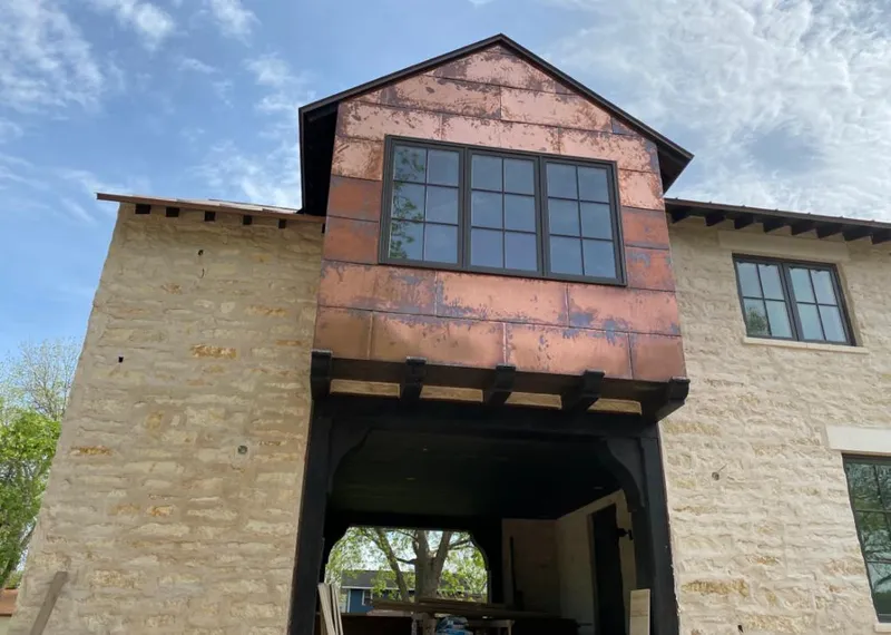 Copper metal panel facade on a stone building for Metal Roof Coating in Clarcona